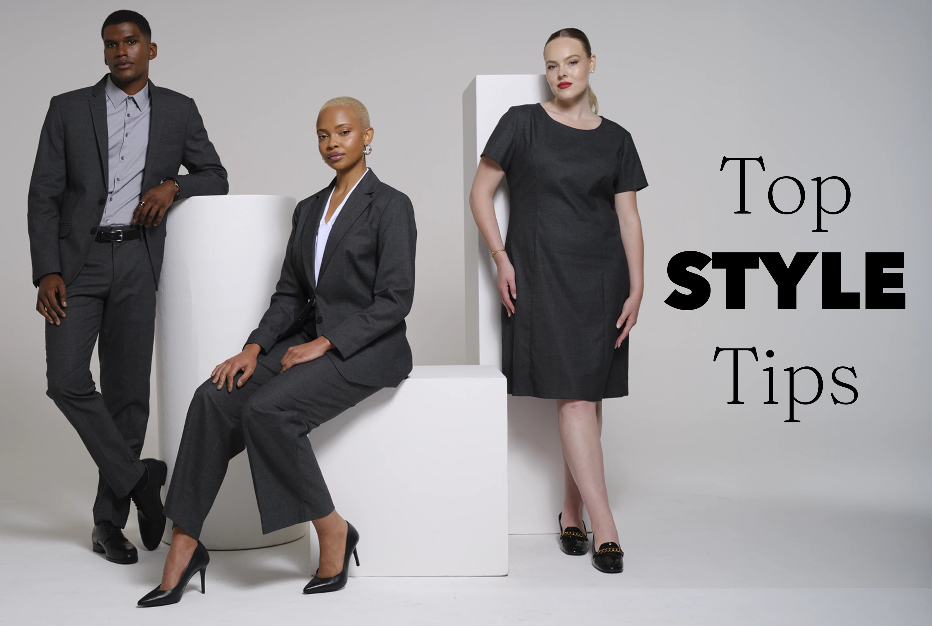 Professional team wearing charcoal suits with white and grey by Imagemakers Corporate Fashion