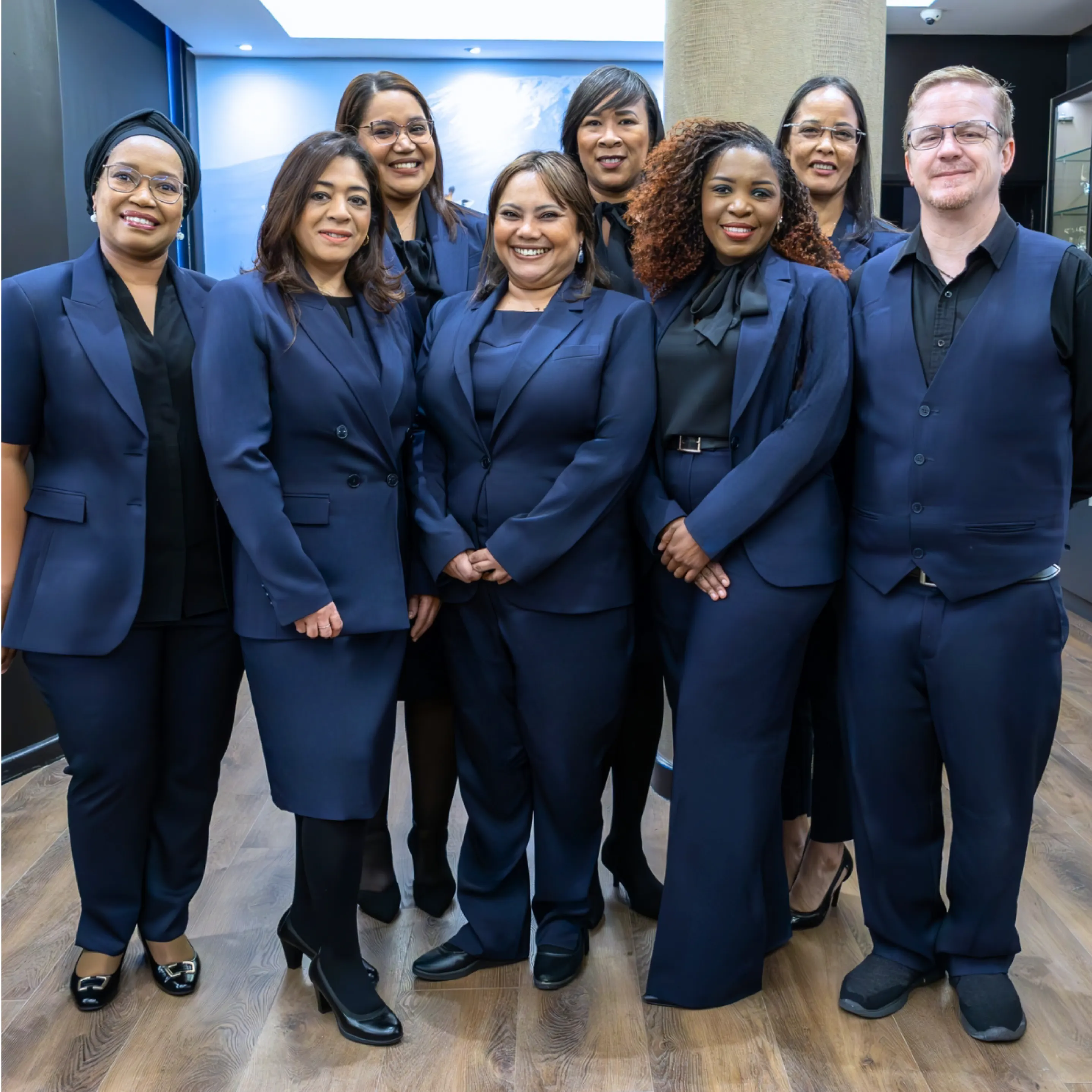 Afrogem Ladies and Men Staff Wearing Navy Corporate Uniforms for Teams by Imagemakers South Africa