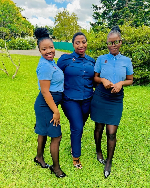 Team of Ladies in Blue Formal Skirts and Corporate Clothing by Imagemakers