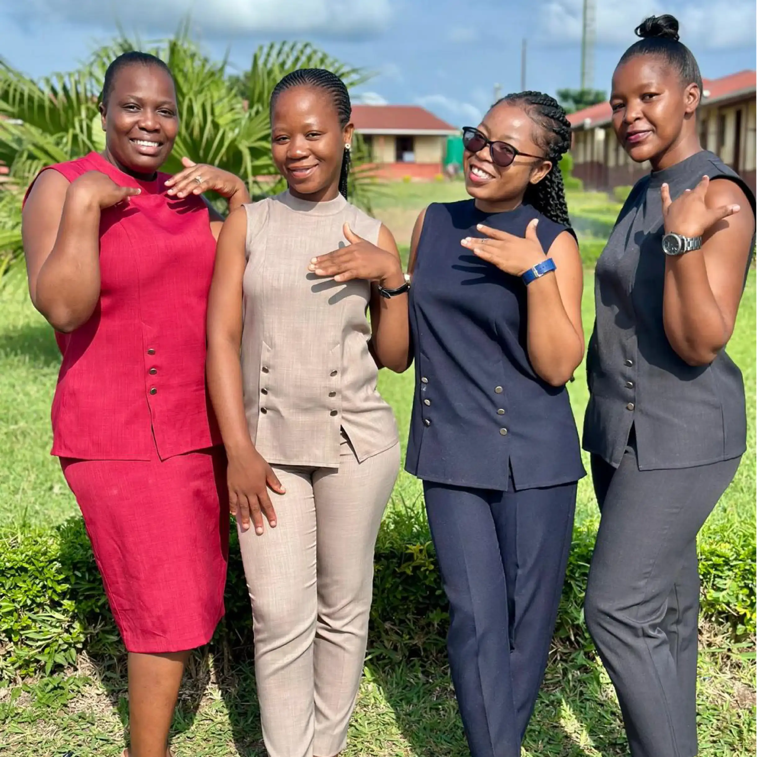 Team of Ladies Wearing Professional Work Outfits and Formal Tops by Imagemakers