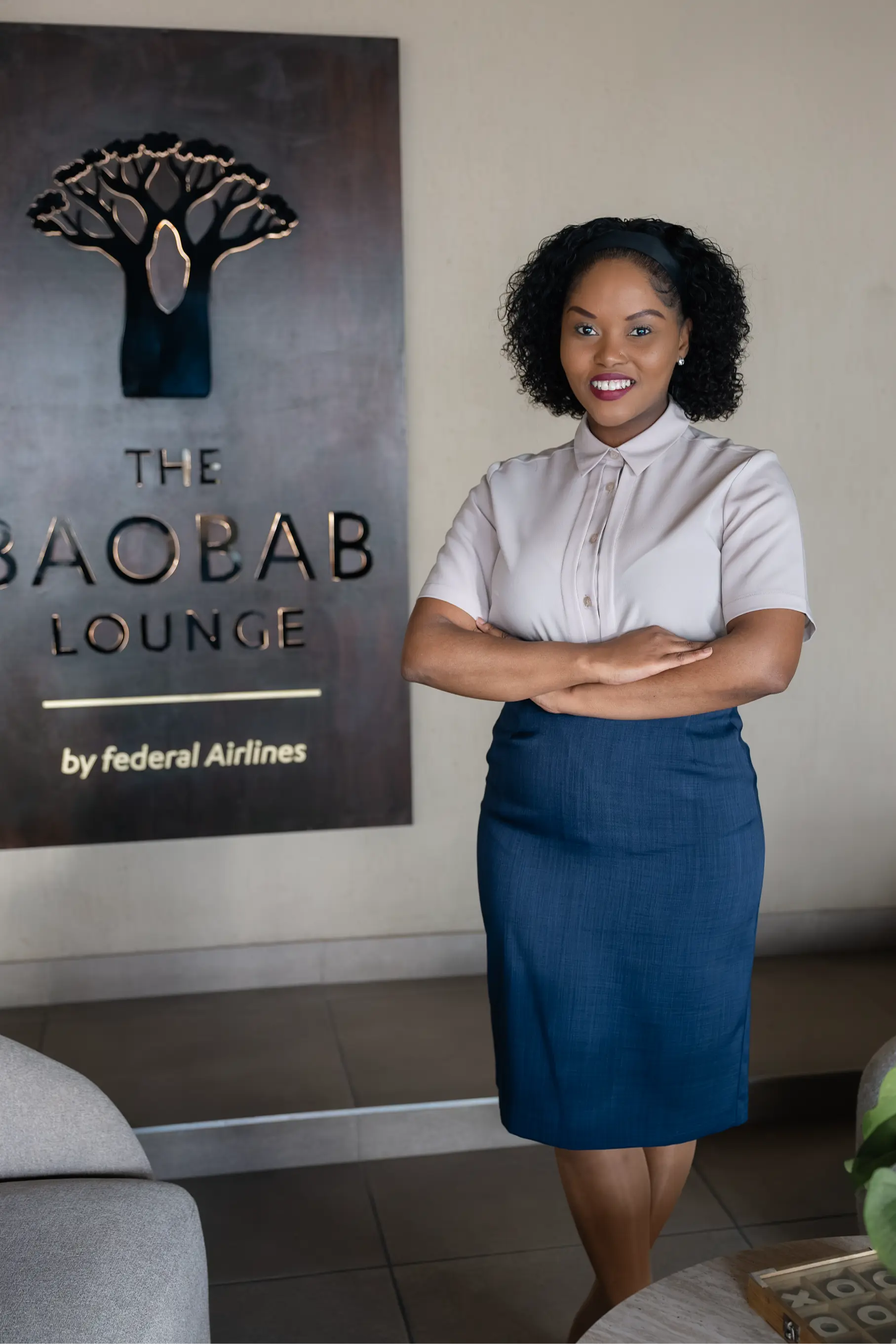 Federal Airlines employee wearing a professional blouse and skirt by Imagemakers