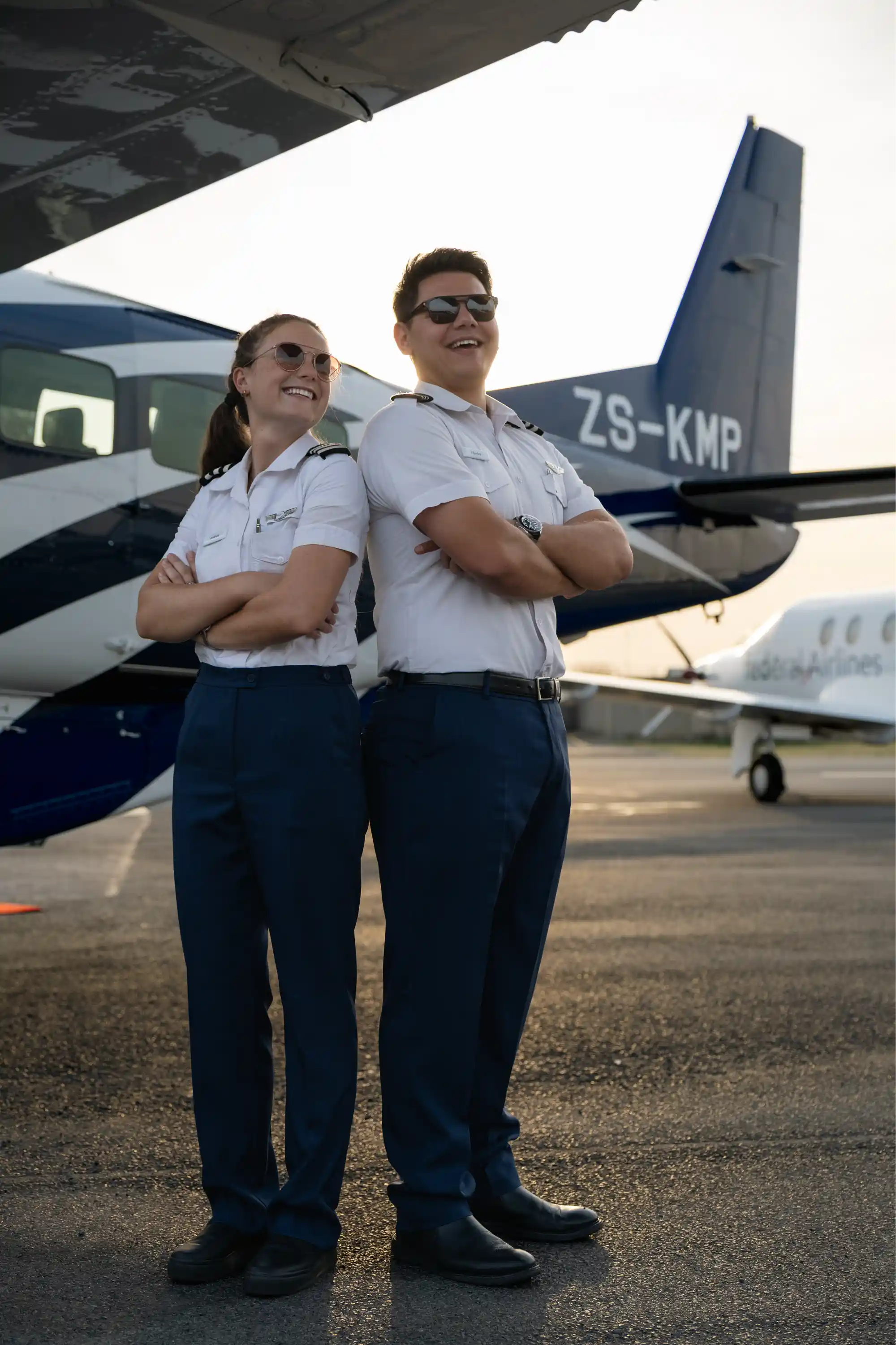 Male and female pilots wearing workwear pants by Imagemakers
