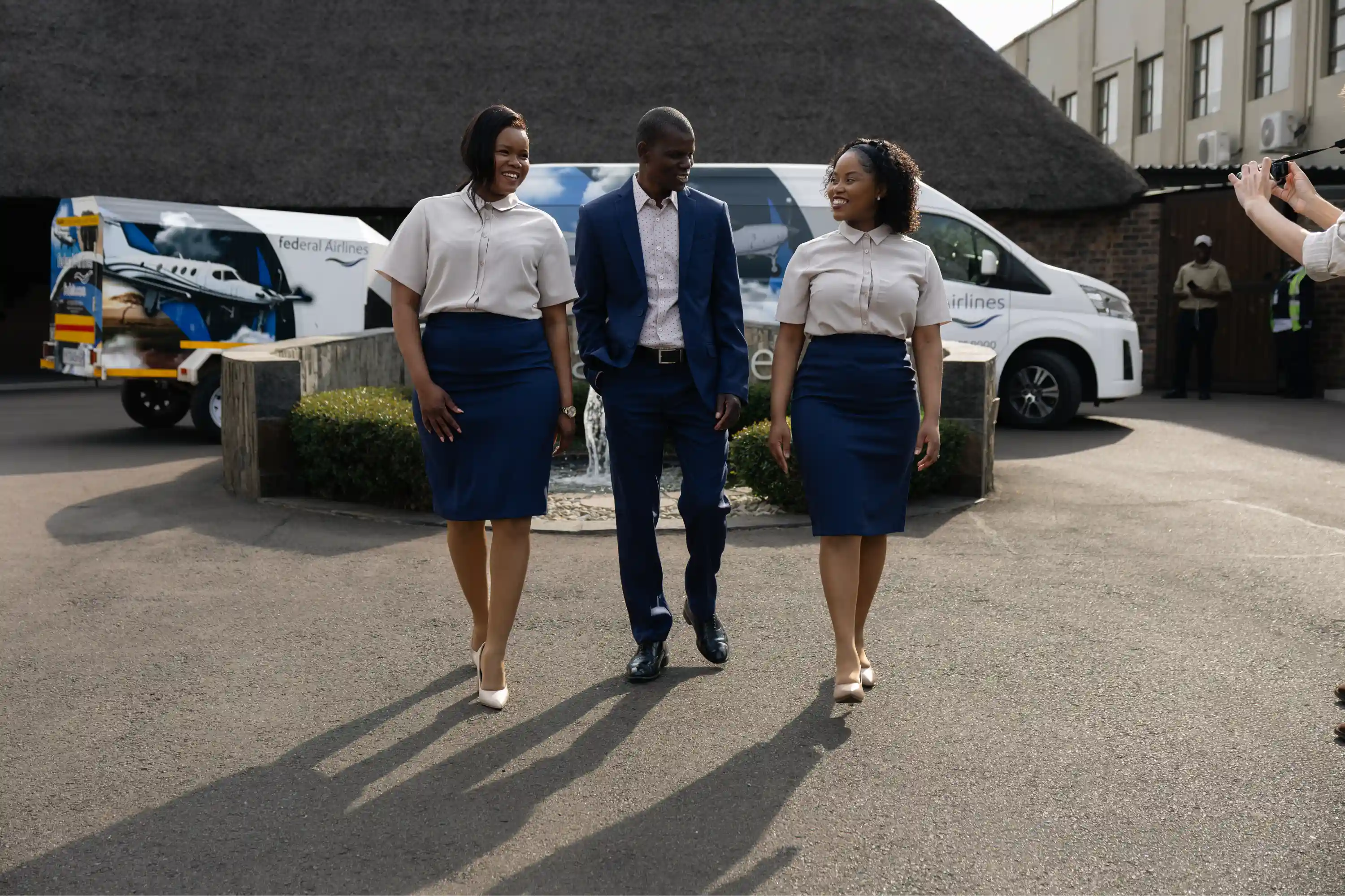 Three Federal Airlines team members wearing Imagemakers workwear outdoors