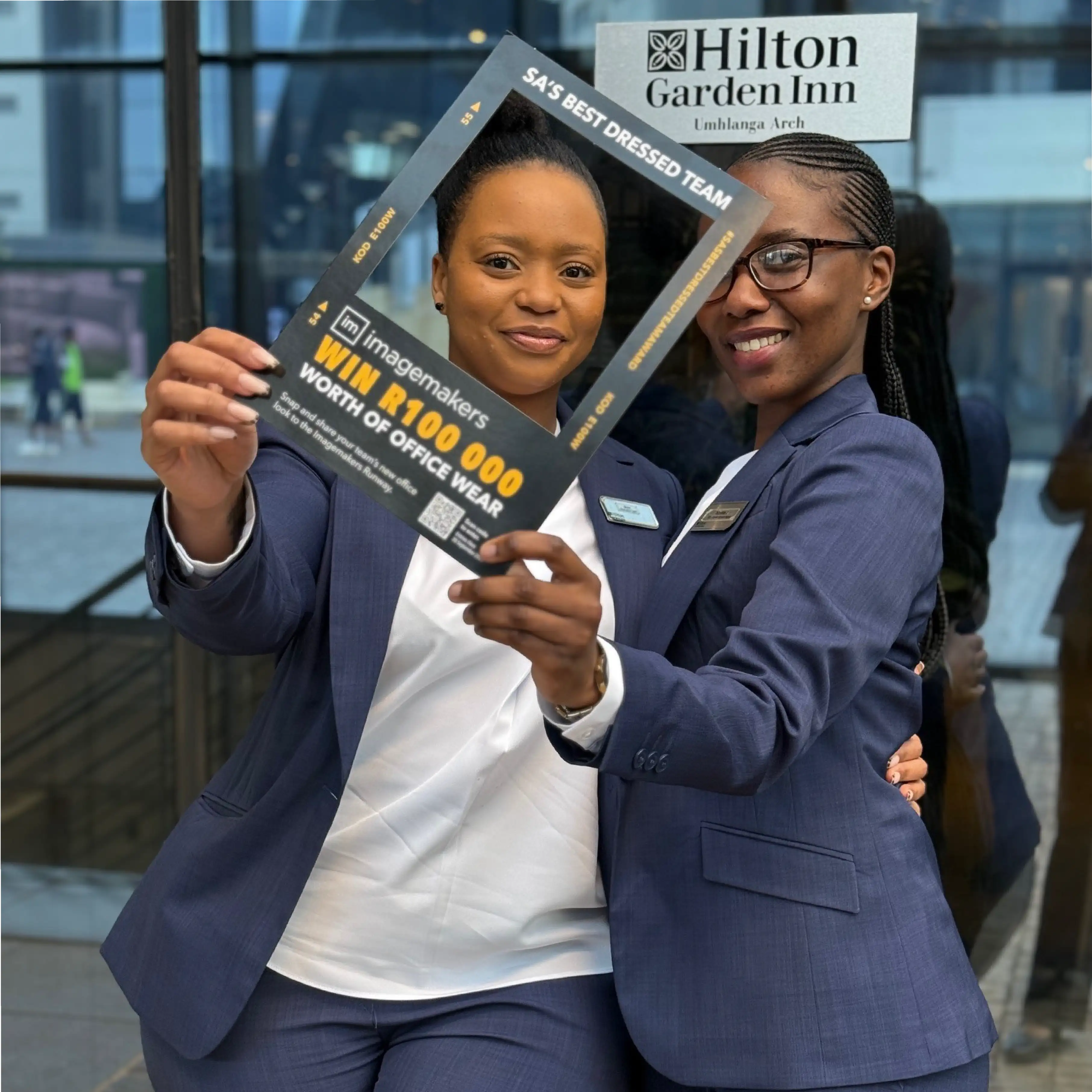 Hilton Garden Inn Ladies Wearing Imagemakers Navy and White Collection of Office Clothes