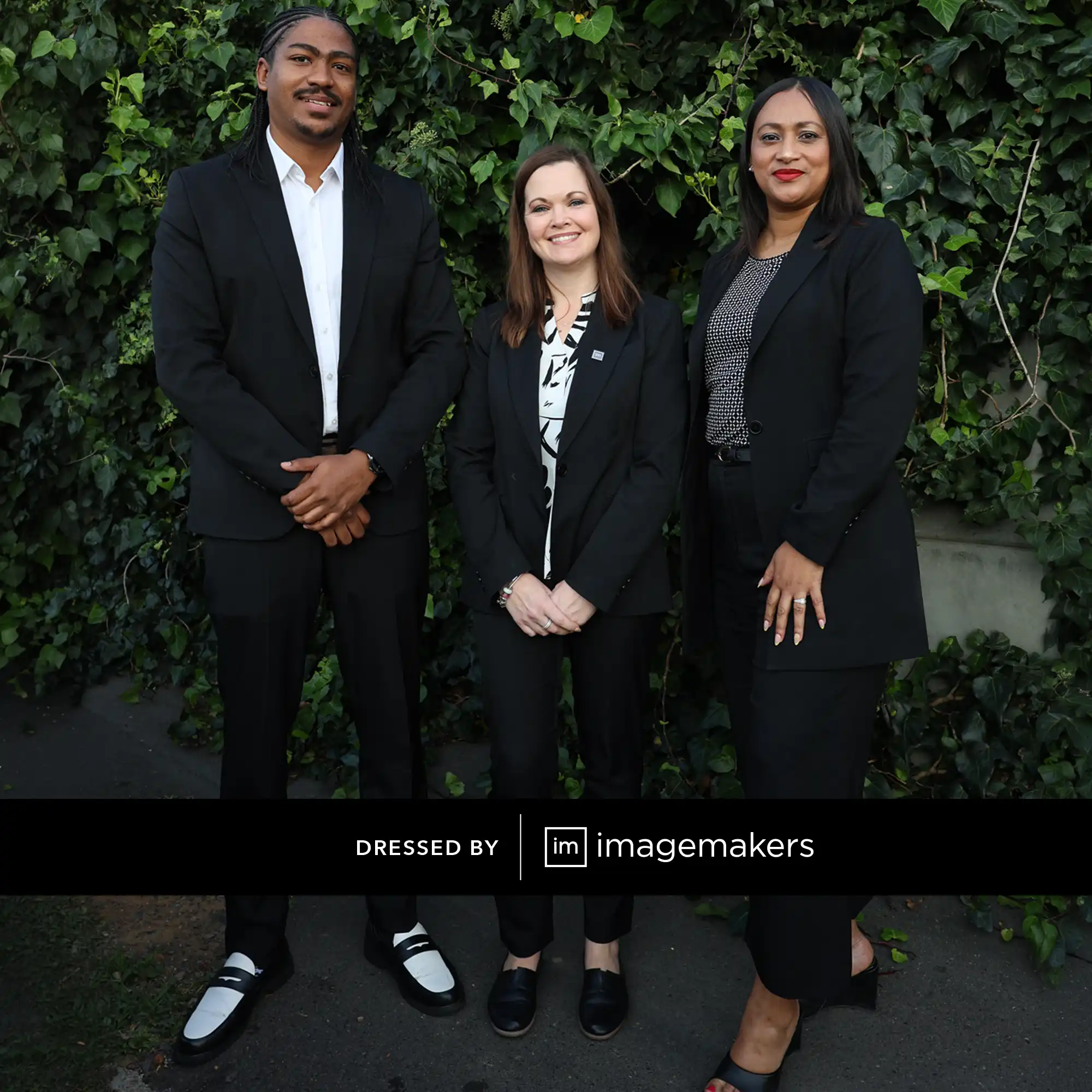 Professional team wearing coordinated black corporate uniforms and workwear by Imagemakers