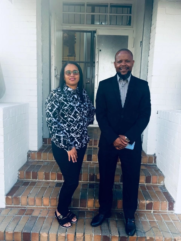 Two professionals wearing coordinated black corporate clothing and patterned shirts by Imagemakers