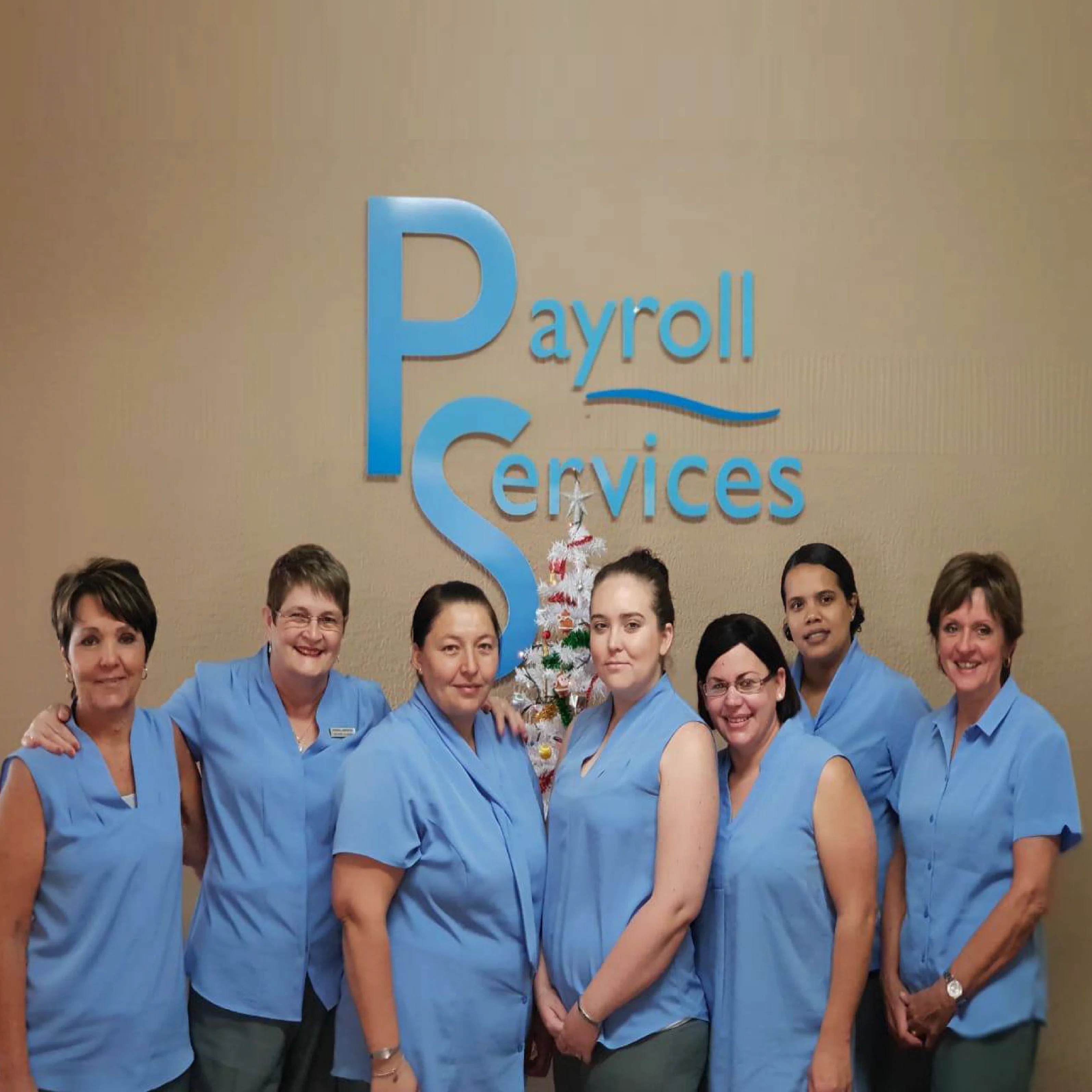 Ladies from Payroll Services wearing True Blue Staff Uniforms by Imagemakers Corporate Fashion
