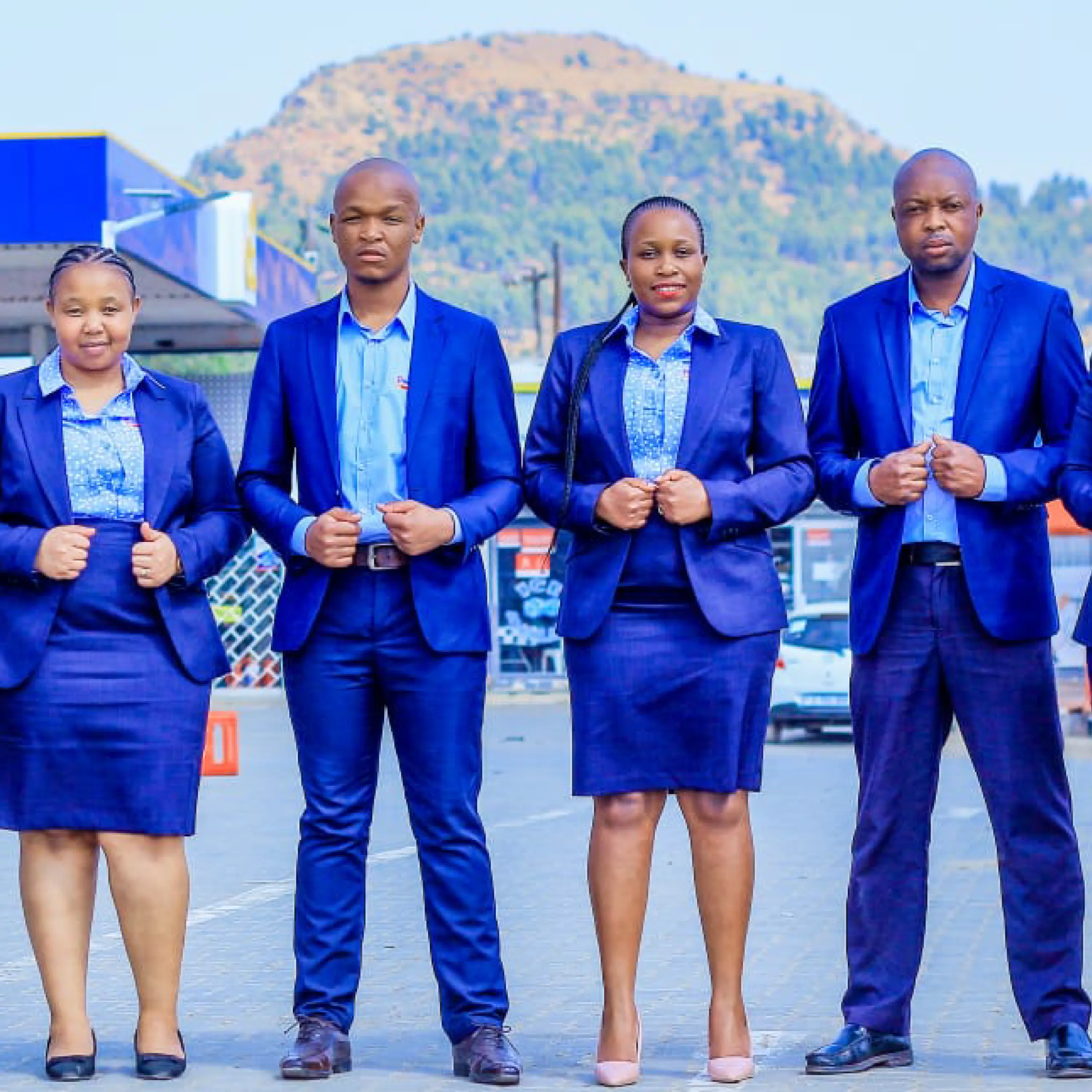 Team of Men and Women in Proffessional Office Uniforms for Teams by Imagemakers