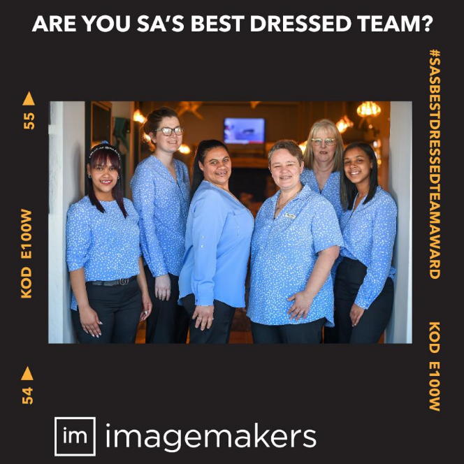 The Great White House Restaurant Staff in Bluebell and True Blue Blouses with Black Pants by Imagemakers Corporate Clothing Suppliers