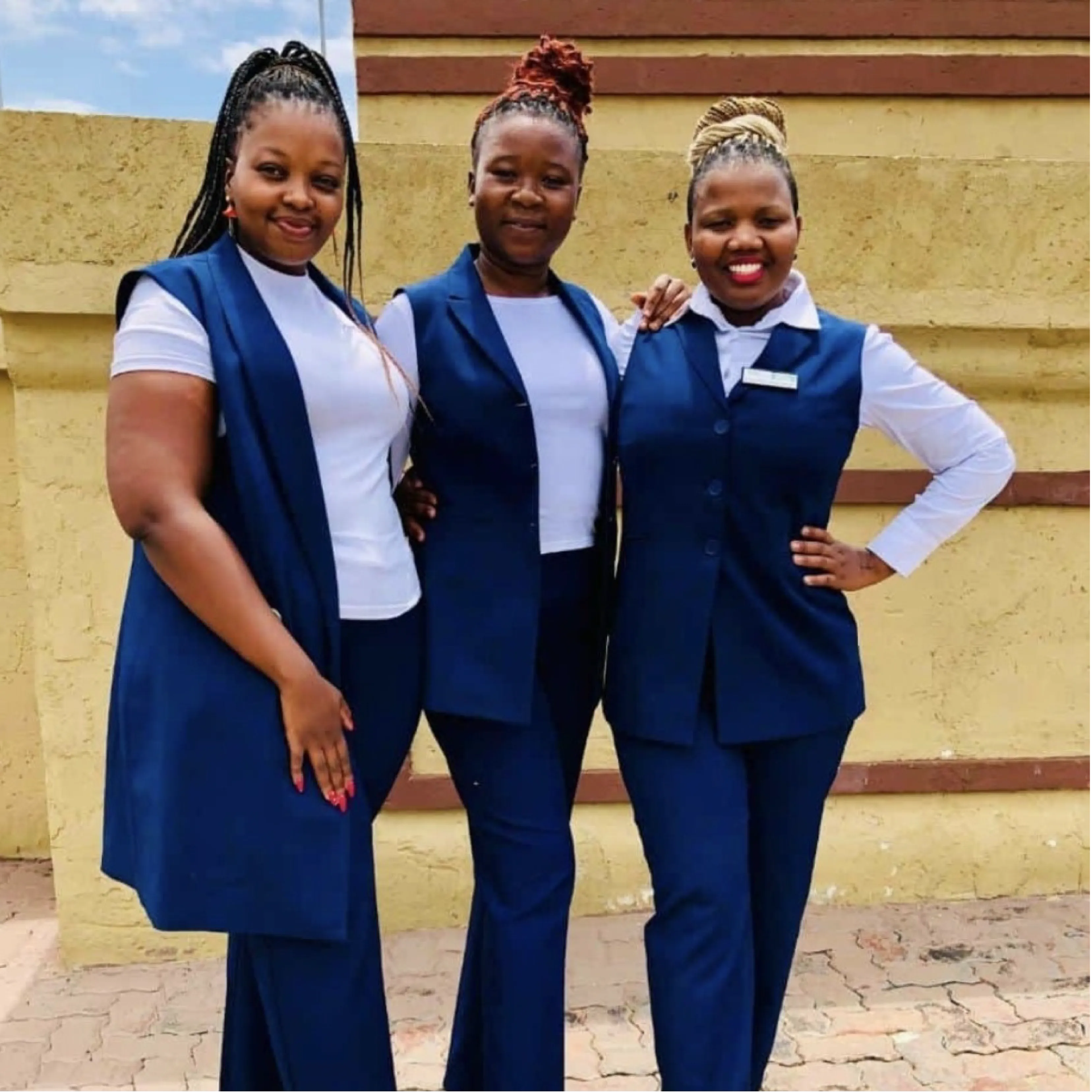 Ladies Team Wearing Navy and White Office Clothing Supplied by Imagemakers